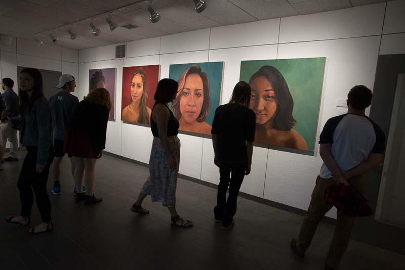 Students at art exhibit